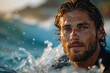 Handsome surfer with intense eyes surrounded by splashing ocean water