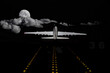 Commercial jet airliner taking off from a runway at night