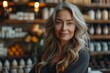 © Larisa AI - Beautiful mature woman with grey hair smiling in an organic store environment