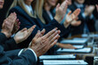 © Alina - Contemporary business people hands clapping at conference