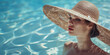 Portrait of a beautiful young woman in a big straw hat 
