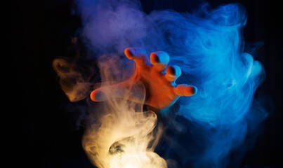 Wall Mural - Mystical smoke in scary hands. Mysterious composition. Fortune teller, mind power, prediction, halloween concept. Wide angle horizontal wallpaper or web banner. Mockup for your logo.