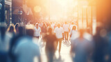 Fototapeta Tulipany - crowd of people on a sunny summer street blurred abstract background in out-of-focus, sun glare image light