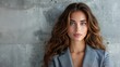 © KaihkoImages - Closeup Stylish Businesswoman in Urban Concrete Background - Offset Copy Space
