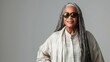 © AdriFerrer - Sophisticated mature woman with long grey hair and sunglasses.