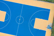 High angle view of the blue and yellow basketball court