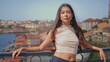 Confident woman posing cityscape vacation portrait. Latina girl looking camera
