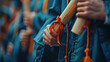Close-up of graduates' hands proudly clutching their diplomas