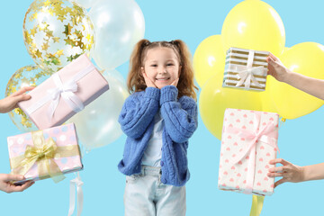 Wall Mural - Happy little girl with female hands holding gift boxes and balloons on blue background