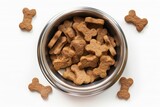 Brown biscuits and crunchy kibble in metal bowl for dogs Pet food concept