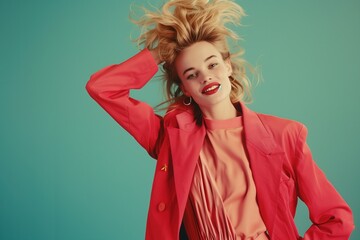 Wall Mural - A stylish young woman with blonde hair, exuding happiness and confidence in trendy 80s attire, posing against a solid color background
