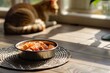 pet food in bowl on mat