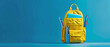 Pop of Color: Yellow School Bag Against Blue Backdrop