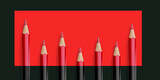 Fototapeta Desenie - Red and black Wooden Crayons pencils in rectangle with transparent image of PNG format extension.