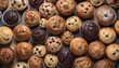 View ro above of a variety of muffins on a wooden plate, chocolate chips, chocolate, cocoa, vanilla, nuts ones