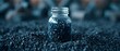 Granular activated carbon in a bottle used for various purification processes like water air and metal extraction. Concept Activated Carbon, Water Purification, Air Filtration, Metal Extraction
