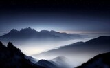 Fototapeta Góry - Majestic Mountain Range Shrouded in Fog and Mist