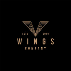 Wall Mural - vintage Letter V wing logo vector icon template on black background