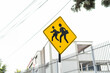 School zone crossing sign on sunny day