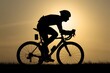 Silhouette of race cyclist, shadow behind the sun, cycling man