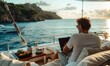 © piai - A man working on a laptop sitting on a luxury yacht