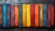 Colorful Wooden Planks Arranged in a Row on a Dark Background