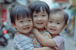 © dobok - Portrait of asian children hugging each other on street