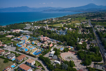 Wall Mural - Aerial panorama of the popular amusement park on Lake Garda. Sights of Italy. Amusement park, attractions on Lake Garda in Italy, aerial view.