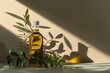   A bottle of olive oil sits on a table, beside a plant A lemon's shadow graces the wall