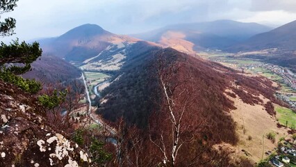 Canvas Print - Bird's eye view of the Carpathians in autumn, a drone flies over Ukraine. beech, birch and conifer forests of fantastic color, dirt roads for travel