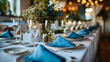 A table set with place settings and blue napkins