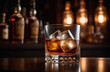 © Oksana - Whiskey on the rocks. Glass whiskey with ice on bar counter with moody dark background