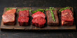 Fresh, marbled meat with rosemary and spices on a wooden board for cooking a gourmet meal