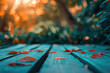 Dry leaves on a wooden terrace. Blurred trees in the background. Created with Generative AI technology.