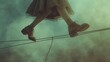 Person walking on a tightrope wearing elaborate, mismatched shoes, symbolizing the delicate balance required for fancy footwork in life. The image is bathed in soft, dreamlike lighting.