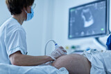 Fototapeta Do przedpokoju - doctor examining patient, Patient undergoing ultrasound scanning in a hospital ward (selective focus)