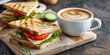 © Oleksandr - white cup with coffee, sandwiches, on a light wooden board