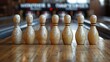 A perfect lineup of ten white bowling pins standing on a wooden bowling alley lane, ready for a strike.