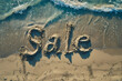 Summer sale. Sale word spelled out on a tropical beach