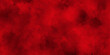 Red powder explosion cloud on black background.abstract Halloween or Christmas cloudy banner,used as a background in abstract style.	