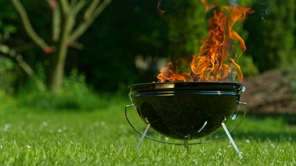 Sticker - Super Slow Motion of Burning Wooden Logs With Empty Grill. Filmed on High Speed Cinema Camera, 1000 fps. Grill and Barbecue on Garden.