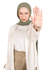 Wall Mural - Showing stop gesture,  young serious strict muslim woman in hijab showing stop gesture. Close up open palm hand image. Islam religious concept idea. Isolated transparent png background. 