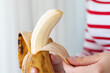 Woman hands peeling a banana
