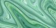 Green liquid acrylic paints marble texture. liquid background. Decorative Oil Wavy Ebru. Modern design element onyx paint marble texture. Messy Swirl Oil Background.