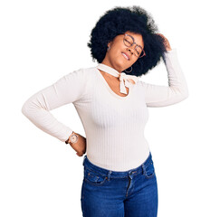 Poster - Young african american girl wearing casual clothes and glasses stretching back, tired and relaxed, sleepy and yawning for early morning