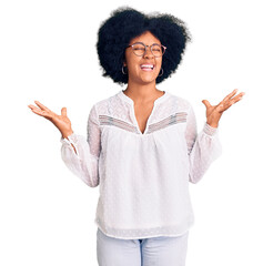 Wall Mural - Young african american girl wearing casual clothes celebrating mad and crazy for success with arms raised and closed eyes screaming excited. winner concept