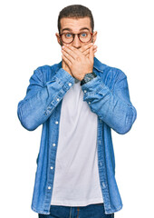 Poster - Young caucasian man wearing casual clothes shocked covering mouth with hands for mistake. secret concept.