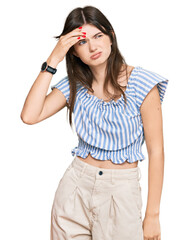 Wall Mural - Young beautiful caucasian girl wearing casual clothes worried and stressed about a problem with hand on forehead, nervous and anxious for crisis