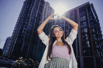 Poster - Photo of positive attractive young lady toothy smile arms fingers show heart symbol sunlight weekend harmony walk outside