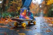 Star-patterned skate shoes glide on a skateboard along a wet, leaf-strewn path in fall